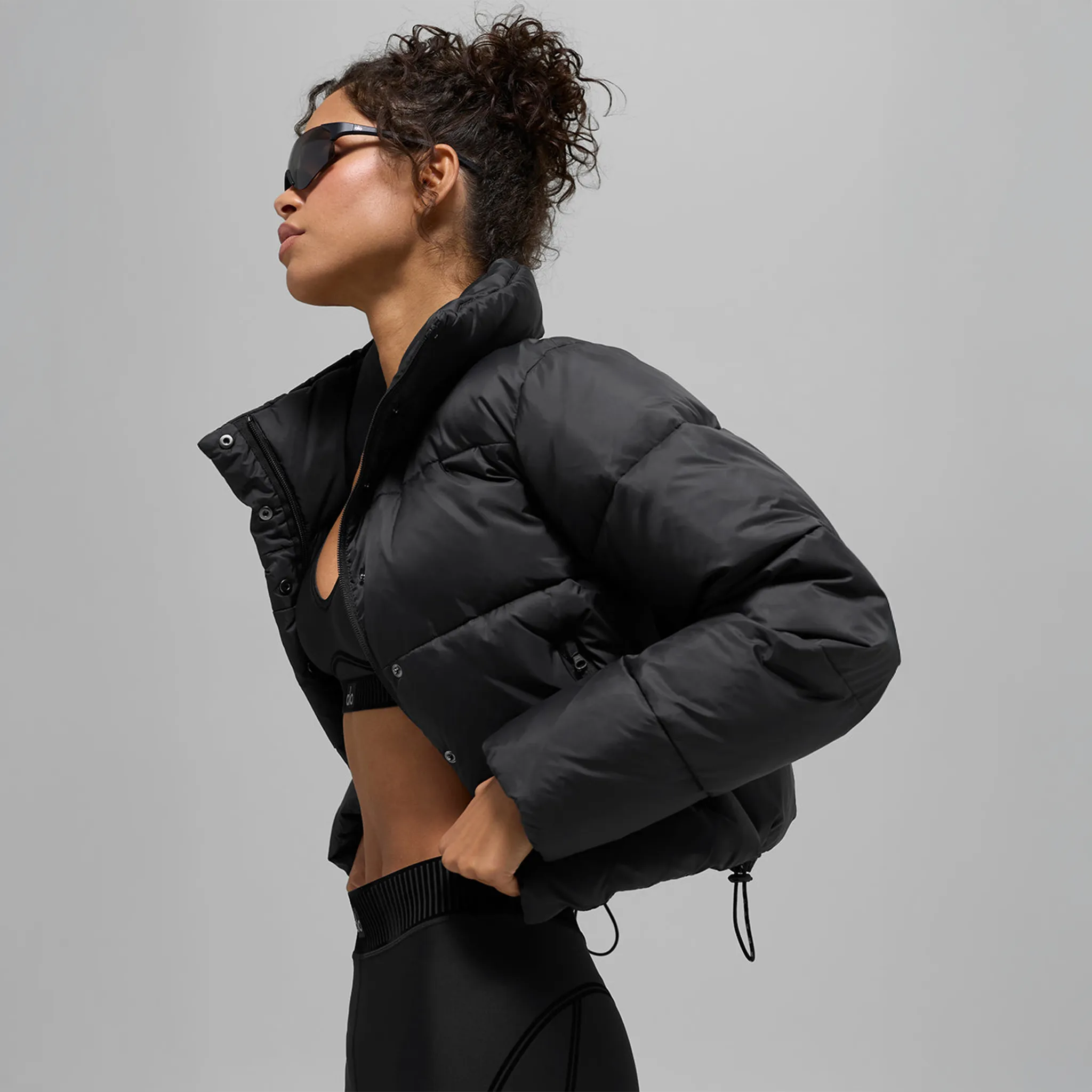 Front Side View of Alo Yoga Gold Rush Black Puffer Jacket (W)